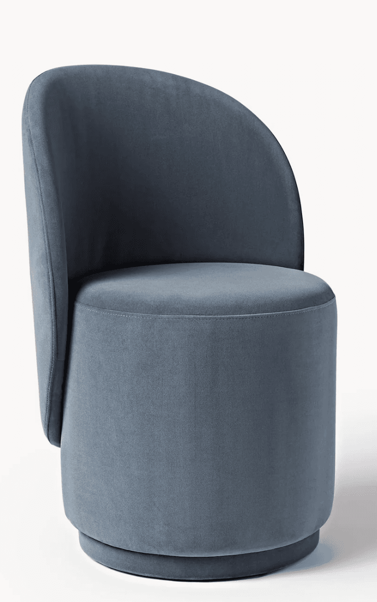 An armless barrel accent chair upholstered in a soft, dusty blue velvet-like fabric. The chair features a continuous, rounded backrest that flows into the seat, and a cylindrical base, creating a cohesive and minimalist silhouette. — 3D model