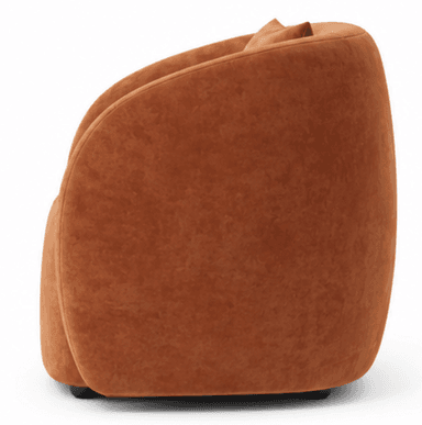 A contemporary, rounded accent chair upholstered in a rust-colored velvet fabric, featuring a barrel-shaped body and a small, loose back cushion at the top. — 3D model
