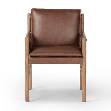 A contemporary armchair with a wooden frame and leather upholstery. The frame consists of four cylindrical legs connected by horizontal supports, forming a simple yet sturdy structure. The seat and backrest are upholstered in brown leather, with the armrests also featuring leather coverings with decorative stitching. The overall design suggests a blend of rustic and modern aesthetics. — 3D model