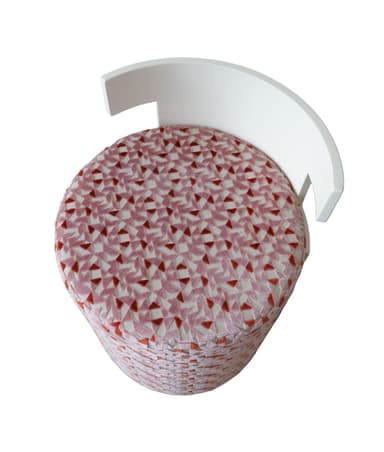A contemporary cylindrical stool featuring a pink and red geometric patterned upholstery and a distinctive T-shaped white backrest. The base is fully upholstered with a textured fabric, while the backrest provides a clean, minimalist contrast in a solid color. — 3D model