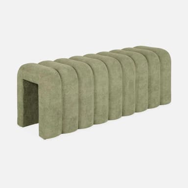 A plush bench with a channeled or fluted design. The piece features vertical, rounded channels across its surface, creating a consistent, textured aesthetic. It appears to be upholstered and has a low profile, suggesting it could be used for seating or as an ottoman. — 3D model