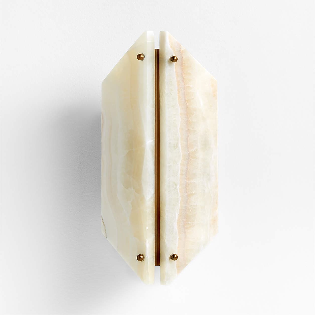 A wall-mounted light fixture featuring two elongated hexagonal panels of translucent, variegated onyx, secured by four brass-toned studs. A central brass channel runs between the two panels, suggesting an internal light source designed to emit diffused light. — 3D model