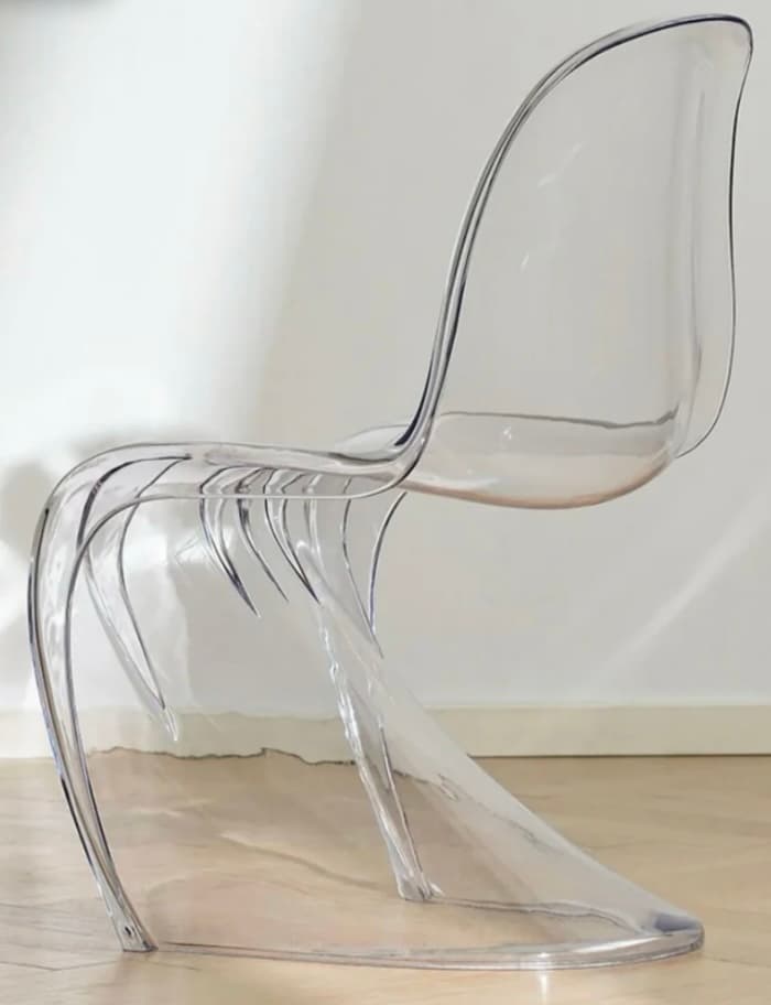 A translucent, single-piece, S-shaped cantilever chair, rendered in a light, almost clear white finish. — 3D model