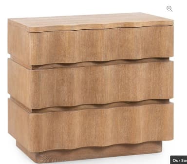 A compact, light-colored wooden nightstand featuring three drawers with distinct wavy fronts, resting on a recessed plinth base. — 3D model