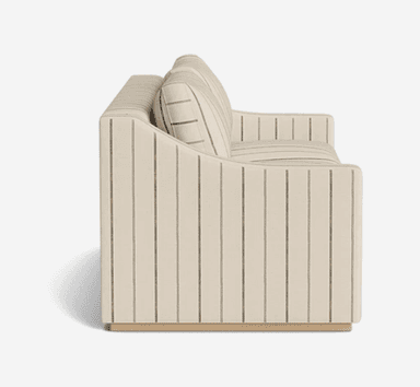 A contemporary two-seater sofa or loveseat upholstered in a light, striped fabric and resting on a wooden plinth base. The back and armrests feature vertical stripes, while the seat and back cushions have horizontal stripes. The design is low-profile with gently curved arms. — 3D model