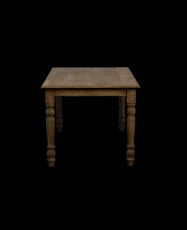 A long, rectangular dining table with four turned legs. The tabletop appears to be solid and has a natural wood grain visible. The legs have a distinct baluster shape, with bulbous sections and turned details, indicative of a traditional or farmhouse style. — 3D model