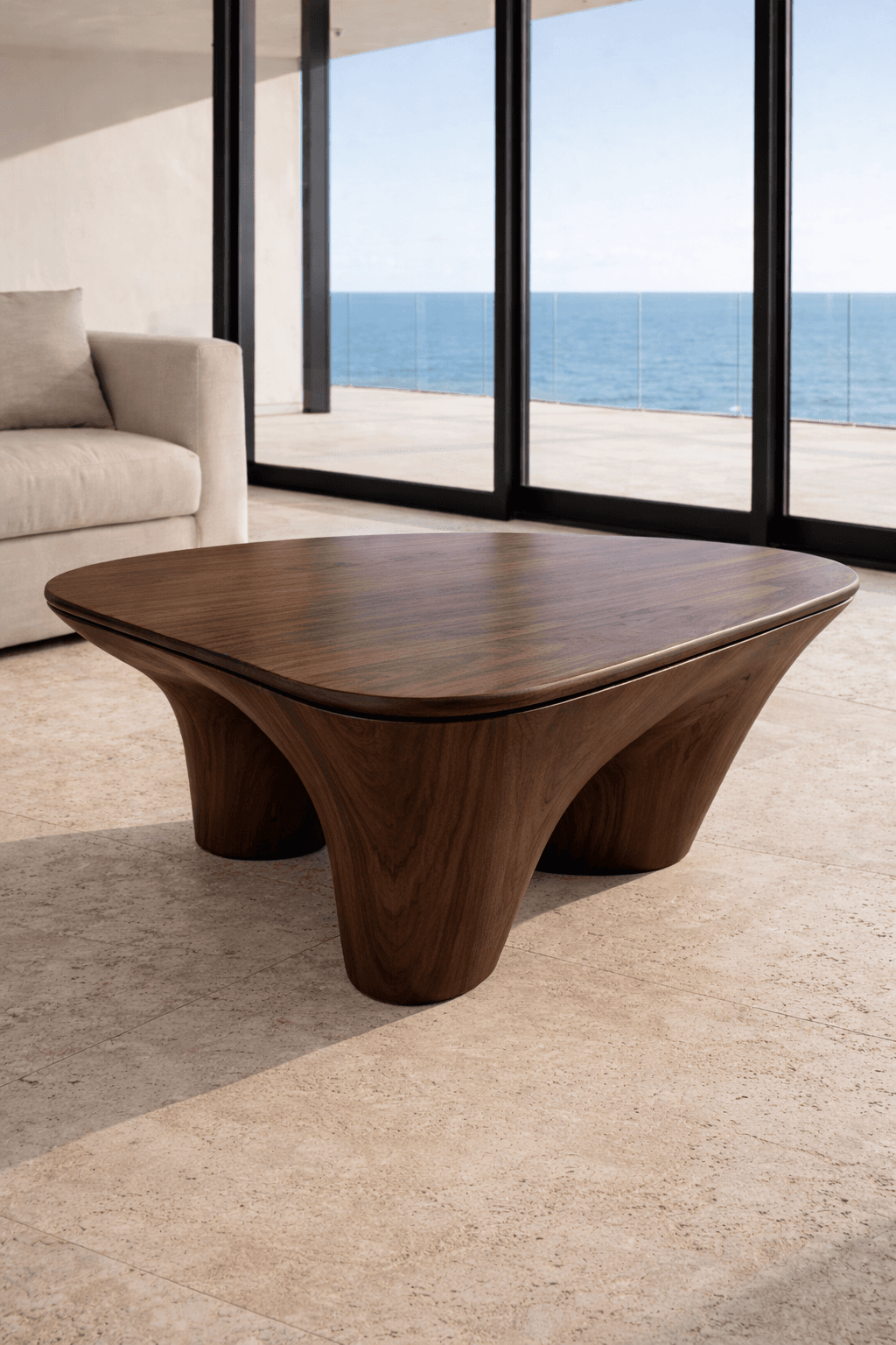 A low-profile, square-shaped coffee table with rounded corners. It features a dark wood finish with a prominent grain pattern. The table has a unique base structure with four flared legs that curve inwards towards the tabletop, creating a sculptural aesthetic. The surface appears smooth and solid. — 3D model