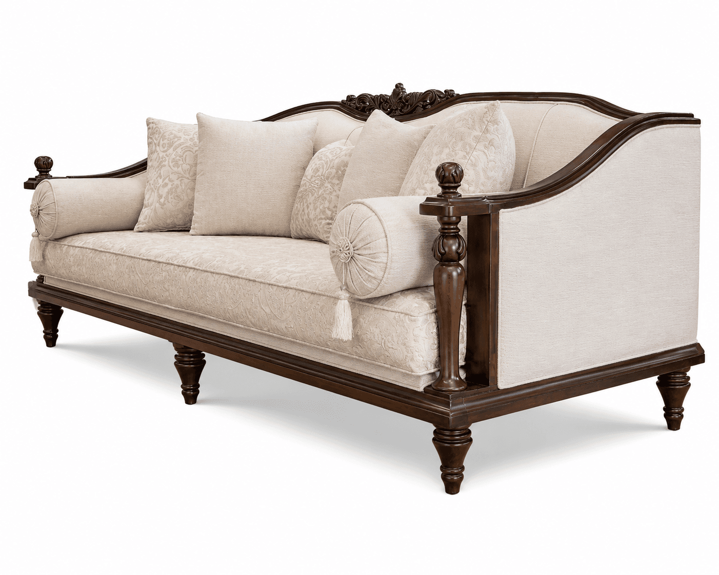 A traditional style sofa featuring a dark, elaborately carved exposed wooden frame and light-colored fabric upholstery. The sofa includes multiple decorative throw pillows and two cylindrical bolster pillows at each end. The back has a distinctive carved crest rail, and the legs are turned wood. — 3D model
