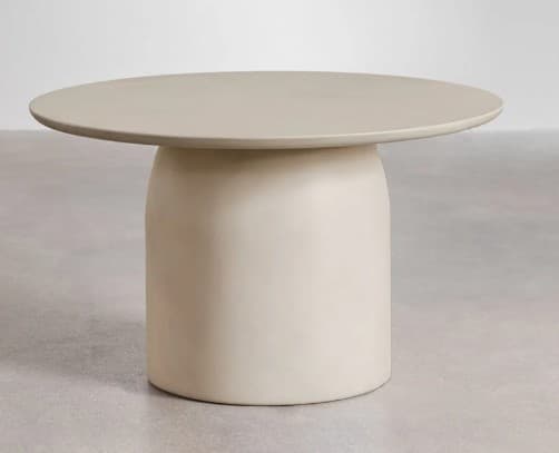 A round coffee table with a single pedestal base. The tabletop is flat and circular, seamlessly transitioning into a stout, cylindrical base that tapers slightly inward at the top. The base has rounded edges and a smooth, matte finish. — 3D model