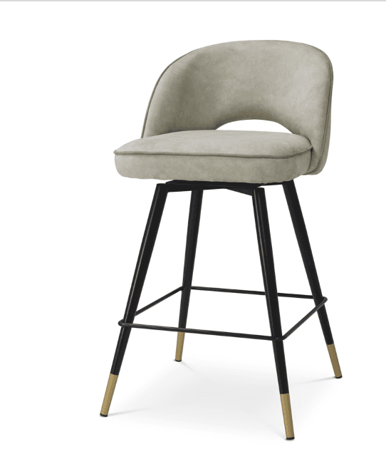 A contemporary bar stool featuring a comfortable upholstered seat and a curved backrest with a distinctive cutout detail. The seat swivels 360 degrees. It is supported by four splayed black metal legs, interconnected by a circular footrest, and finished with elegant brass-capped feet. — 3D model