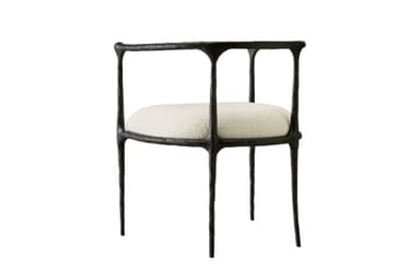 An armchair featuring a dark, heavily textured, and organically shaped cast metal frame paired with a light-colored, upholstered seat cushion. — 3D model