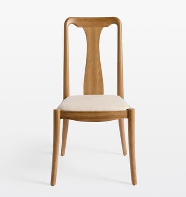 A modern dining chair constructed from light-toned oak wood with a distinctive T-shaped backrest and an upholstered seat cushion. The chair features a minimalist design with clean lines and gently curved elements. — 3D model