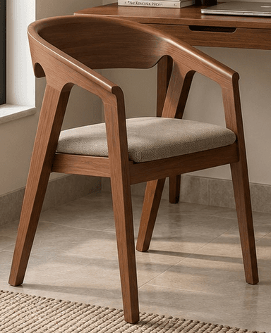 A modern wooden armchair featuring a seamless, curved backrest that flows into integrated armrests. The chair has a comfortable padded seat upholstered in a light, neutral fabric, supported by a sturdy wooden frame. — 3D model