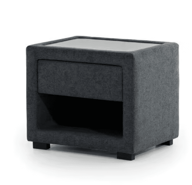 A contemporary bedside table upholstered in a dark grey fabric, featuring a recessed glass top, a single storage drawer, and an open storage cubby. The design is minimalist with clean lines and stands on small, black, recessed feet. — 3D model