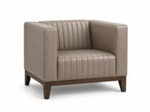 A modern club armchair featuring a boxy silhouette, upholstered in a beige or taupe material with distinctive vertical channel tufting on the backrest and seat. It has wide, square armrests and an exposed dark wood base with short, tapered block legs. — 3D model