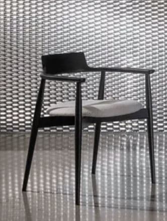 A modern dining chair with a black wooden frame, featuring a gently curved backrest that integrates into armrests, and an upholstered light grey seat cushion. The legs are tapered. — 3D model