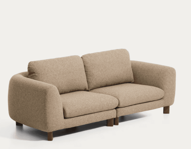 A modern two-seater sofa upholstered in a light beige, textured fabric. The sofa features rounded arms, a low profile, and two distinct seat cushions paired with two back cushions. It is supported by short, dark wooden cylindrical legs. — 3D model