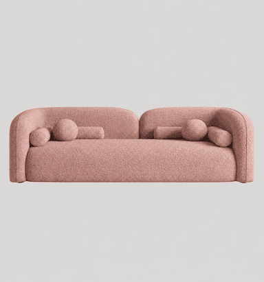 A contemporary, three-seater sofa characterized by its curvilinear form and plush bouclé upholstery. It features low, continuously rounded armrests and backrest, creating a seamless, sculptural silhouette. The sofa is finished in a light pink bouclé fabric and includes two cylindrical bolster pillows and one spherical accent pillow, all upholstered in the same material. — 3D model