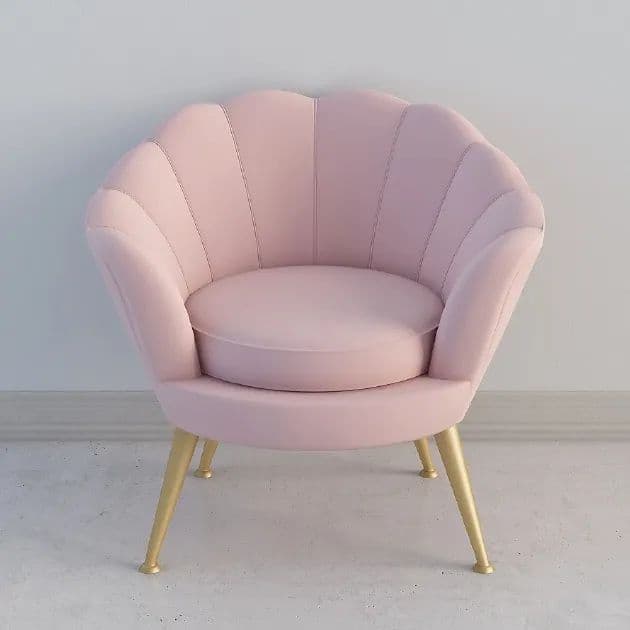 An upholstered accent chair featuring a distinctive scalloped, shell-like backrest and seat in a soft pink velvet-like fabric, supported by four tapered gold-finished metal legs. It includes a removable round seat cushion. — 3D model