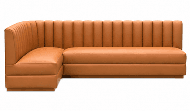 A corner booth-style seating unit with a fluted backrest and upholstered cushions. The unit is L-shaped, designed to accommodate multiple individuals. The upholstery features a consistent sheen, suggesting a synthetic leather or vinyl material. The design incorporates vertical channeling on the backrest and smooth surfaces on the seat and arms. — 3D model