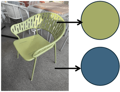 A modern pale green armchair featuring a perforated backrest and integrated armrests, constructed from what appears to be powder-coated metal with tapered legs. — 3D model