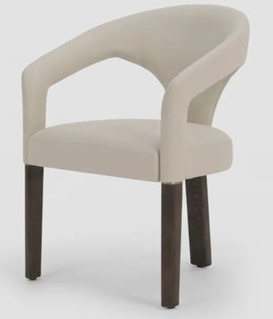 A contemporary armchair featuring a distinctive curved, upholstered backrest that flows seamlessly into integrated armrests. The seat is also upholstered, and the chair is supported by four dark, tapered wooden legs. The overall aesthetic is modern and sleek, with a neutral color palette. — 3D model