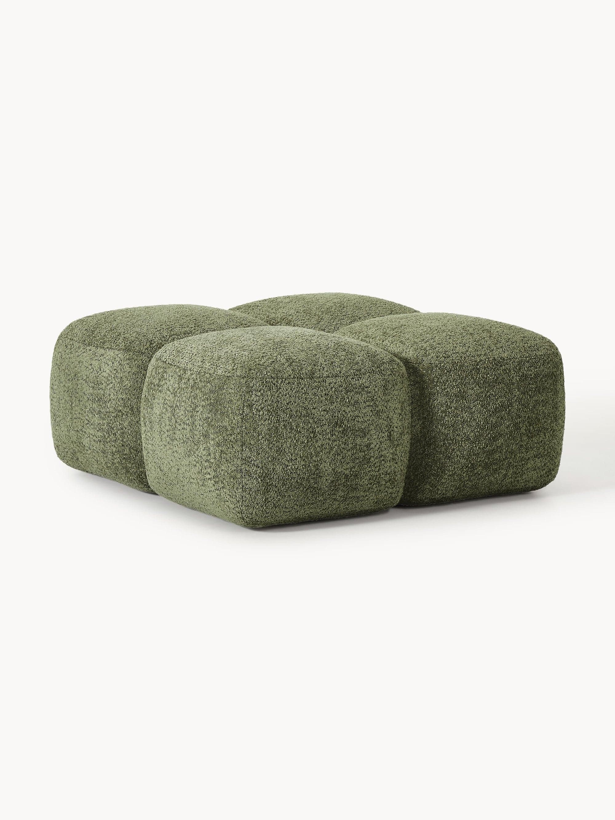 A modular ottoman with a rounded, organic form. The piece is upholstered in a textured green fabric that resembles boucle or a similar looped weave. It appears to be constructed from four connected cubic or slightly rounded modules, creating a softened, quilted effect on the top surface. The overall design is contemporary and plush. — 3D model