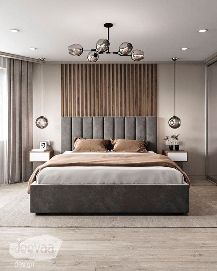 A modern upholstered platform bed with a tall, grey channel-tufted headboard, integrated with white floating nightstands and backed by a vertical slatted wood wall panel. The bed includes white and brown bedding. — 3D model