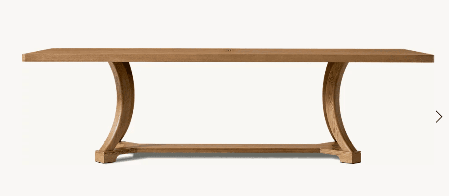 A contemporary dining table made from light-toned wood, likely oak, featuring a rectangular tabletop supported by two distinct arched pedestal bases. Each arched support is connected by a horizontal stretcher at the bottom, creating a sturdy and visually appealing structure. — 3D model