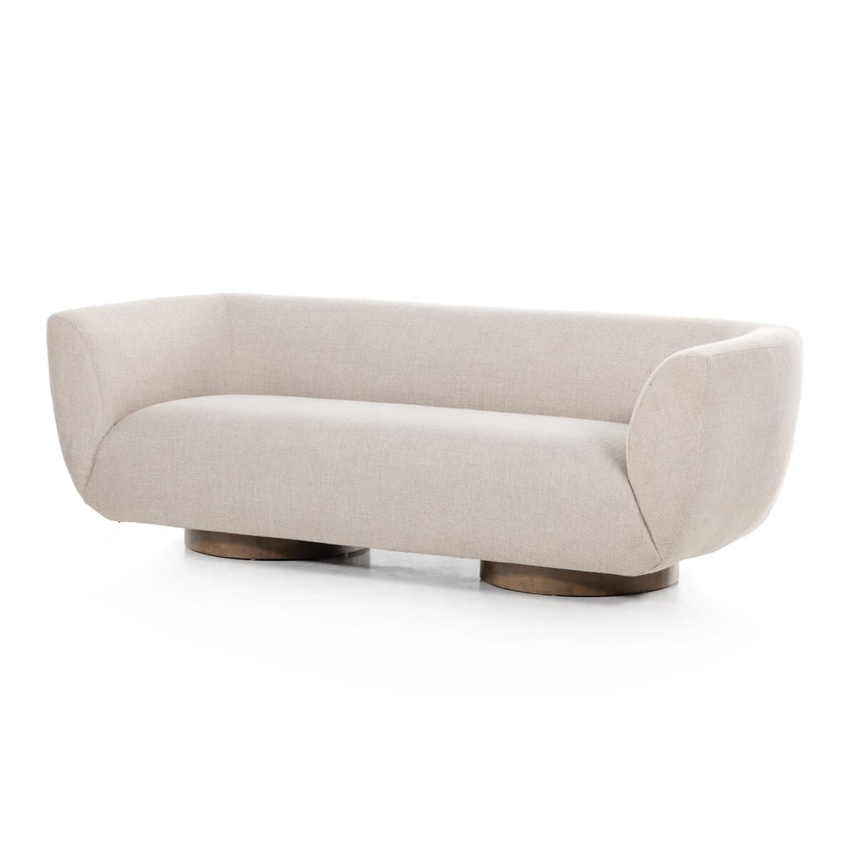 A modern sofa with a curved silhouette and a low-profile, round wooden base. The upholstery is a textured, light-colored fabric. The armrests seamlessly blend into the backrest, creating a continuous, flowing form. The base consists of two prominent, rounded wooden elements supporting the main body of the sofa. — 3D model