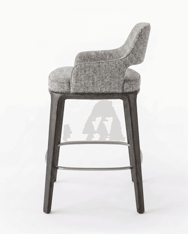 A modern bar stool with a fabric-upholstered seat and backrest, supported by dark-stained wooden legs. The stool features a curved back and armrests integrated into the main body. A metal footrest connects the four legs. — 3D model
