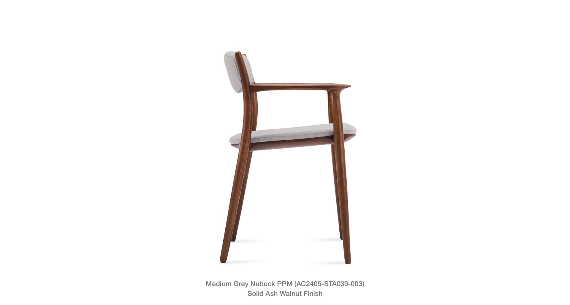 A side profile view of a modern armchair with a wooden frame and upholstered seat and backrest. The frame is constructed from solid ash with a walnut finish. The upholstery appears to be a light grey nubuck fabric. — 3D model