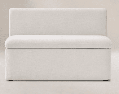 A modern, upholstered armless modular chair unit, depicted in a light, neutral fabric. It features a deep seat cushion and a high backrest, both generously padded. The base is fully upholstered, creating a seamless, floor-standing appearance. The design emphasizes comfort and a minimalist aesthetic, suitable for contemporary interiors. — 3D model