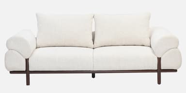 A contemporary loveseat upholstered in off-white bouclé fabric, featuring a plush, rounded design, broad armrests, and a recessed dark wood base with short, cylindrical legs. — 3D model