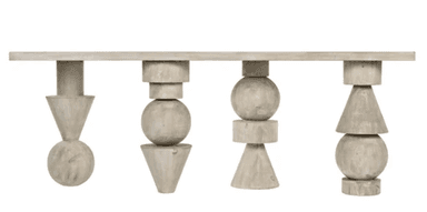 An elongated, rectangular coffee table crafted from wood with a light, whitewashed finish. It features four distinct, sculptural legs, each composed of uniquely stacked geometric shapes such as spheres, cones, and cylinders, providing a dynamic and artistic base. — 3D model