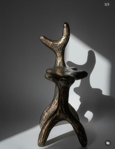 A highly sculptural bronze stool or pedestal, characterized by its abstract, organic forms and textured, dark patinated finish. Its design evokes brutalist and organic modern aesthetics. — 3D model