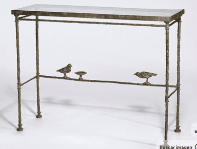 A slender console table with a glass top and a decorative metal base. The base is designed to resemble a branch, featuring two small bird figures and a small dish attached to a lower horizontal support. The legs are thin and textured. — 3D model