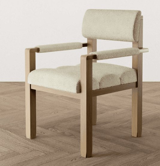 A contemporary armchair featuring a light-toned wooden frame with upholstered seat, backrest, and armrests in a cream-colored textured boucle fabric. — 3D model