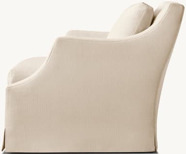 An upholstered armchair featuring a clean, contemporary design with a full skirted base. The chair is covered in a light beige, subtly textured fabric and includes broad, rolled arms and separate, plush seat and back cushions, suggesting comfort and a refined aesthetic. — 3D model