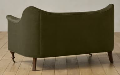 A two-seater sofa with a curved backrest and rolled arms. The sofa is upholstered in a textured fabric and features turned wooden legs. — 3D model