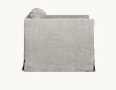 A light grey or off-white slipcovered sofa, viewed from the back, featuring a full skirted base with corner pleats and a separate back cushion. — 3D model
