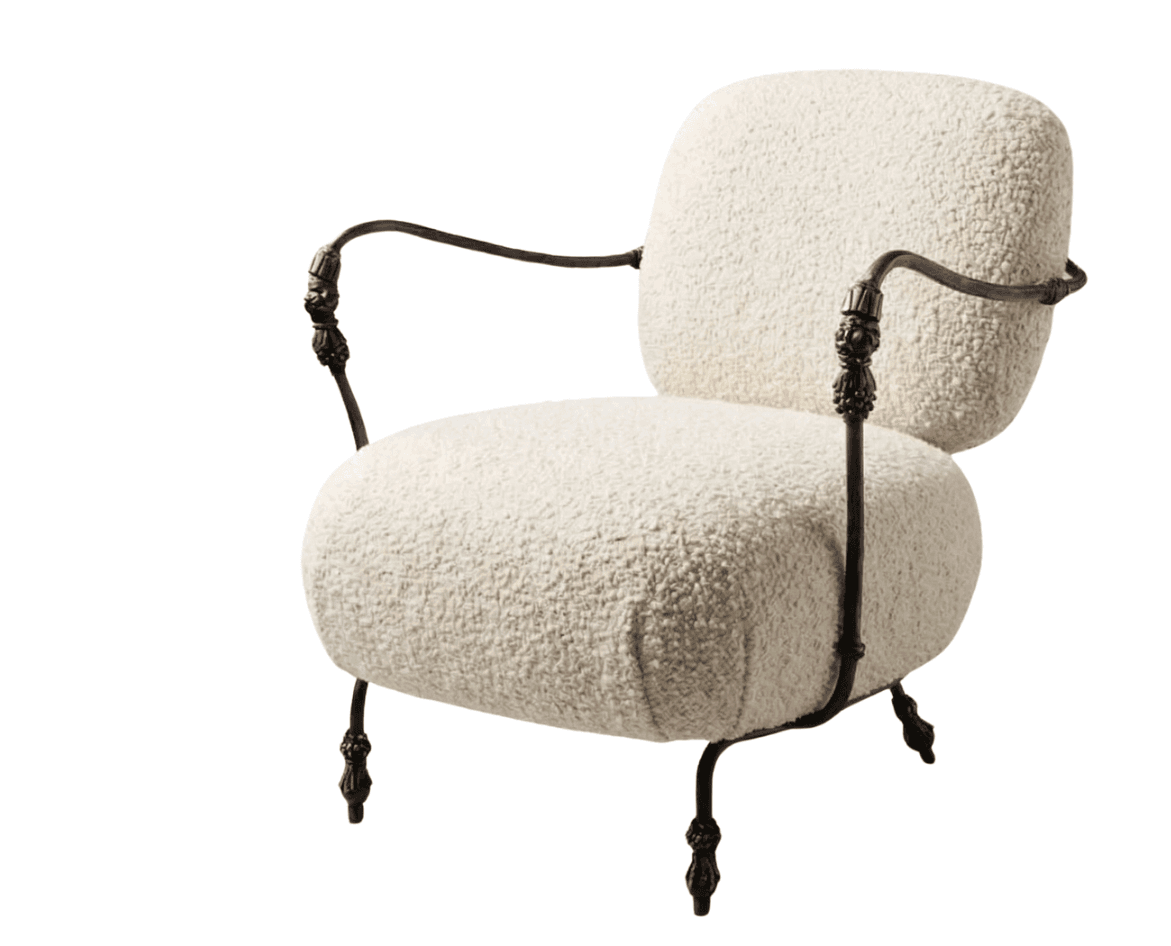 A boucle upholstered armchair with a dark metal frame. The chair features a rounded seat and backrest, and the metal frame has ornate detailing on the legs and armrests. The upholstery has a textured, plush appearance. — 3D model