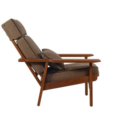 A mid-century modern inspired armchair with a wooden frame and upholstered cushions. The armchair features a high back with an adjustable headrest, armrests, and a separate lumbar cushion. The frame is constructed from dark stained wood, and the upholstery is a textured brown fabric with contrasting black piping. The design emphasizes clean lines and a reclined posture. — 3D model