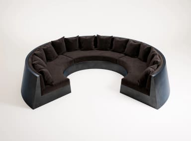 A U-shaped modular sectional sofa with dark brown velvet upholstery and a prominent, dark-toned sculptural base. — 3D model