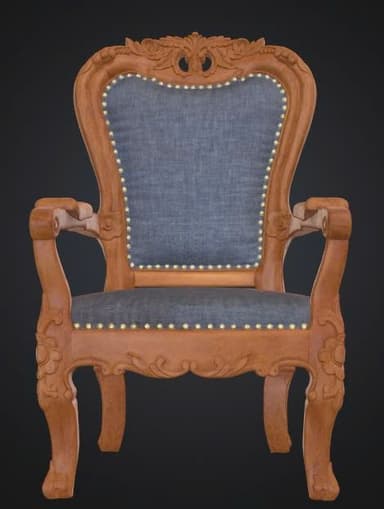 An ornate armchair featuring a carved wooden frame with intricate floral and scroll motifs, upholstered in a blue fabric on the seat and back, accented with brass nailhead trim. The chair has curved armrests and cabriole legs, indicative of historical European design. — 3D model