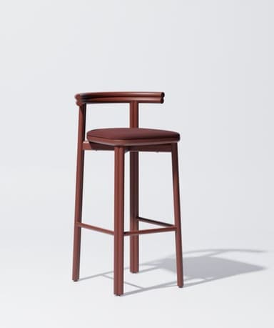 A contemporary bar stool featuring a tubular metal frame in a reddish-brown or burgundy finish, an upholstered seat cushion, and a rounded open backrest. — 3D model