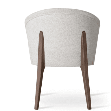 An upholstered dining chair featuring a curved backrest that seamlessly integrates into armrests, all covered in a light, textured fabric. The chair is supported by four dark brown, tapered wooden legs. — 3D model