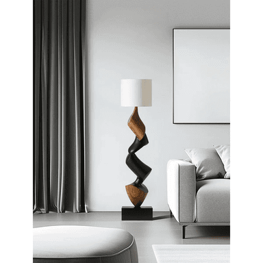 A modern floor lamp featuring a sculptural, twisted base constructed from alternating sections of natural light-toned wood and dark-stained wood. The base rests on a square dark wood plinth, and is topped with a simple cylindrical off-white fabric shade. — 3D model