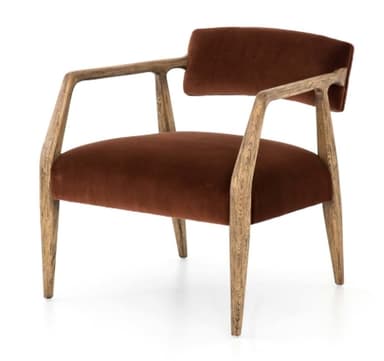 An armchair featuring a solid wood frame with curved armrests and upholstered seat and back in a rust-colored velvet fabric. The wooden frame exhibits a prominent grain, suggesting oak or a similar light-colored wood, and includes four tapered legs. The design combines mid-century modern aesthetics with contemporary comfort. — 3D model