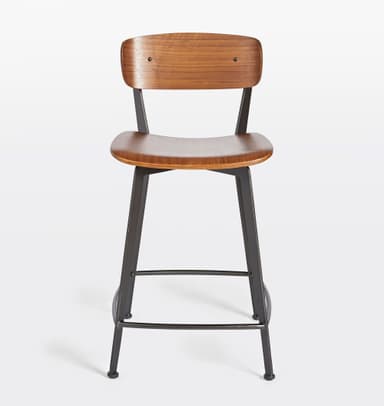 A bar stool with a backrest, featuring a wooden seat and back panel, supported by a dark metal frame. The seat and back panel appear to be made of bent wood or plywood with a wood grain finish. The frame consists of angled legs connected by a footrest at the bottom and supports for the seat and back. The design is modern and minimalist. — 3D model